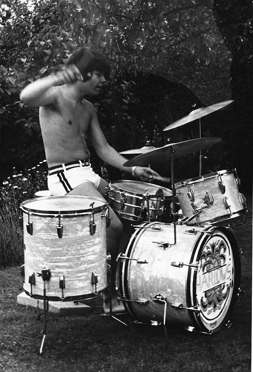 The pre-ACHE beginnings: Glenn Fischer drumming in the garden